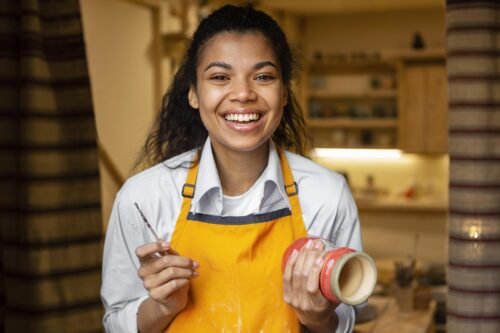 happy-woman-holding-clay-pot